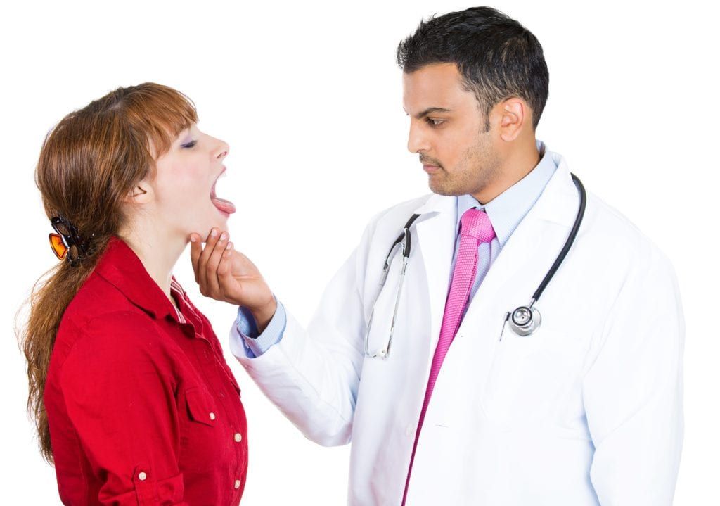 Dentist examining a patient's mouth
